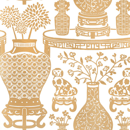 Gold Chinese-style vases with floral branches, Foo dogs & ornate pedestal table on white.