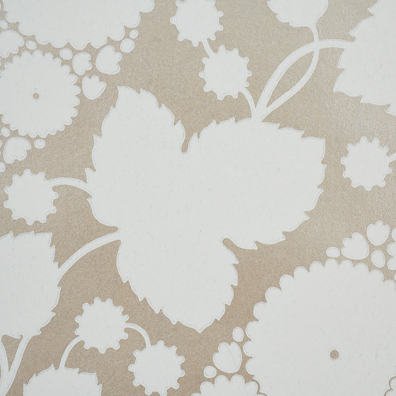 Beige wallpaper with large white leaf silhouettes and small floral motifs; retro botanical pattern.