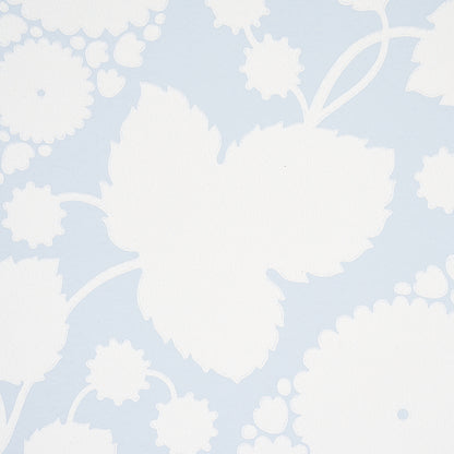 Pale blue wallpaper with large white floral silhouettes in a damask style.