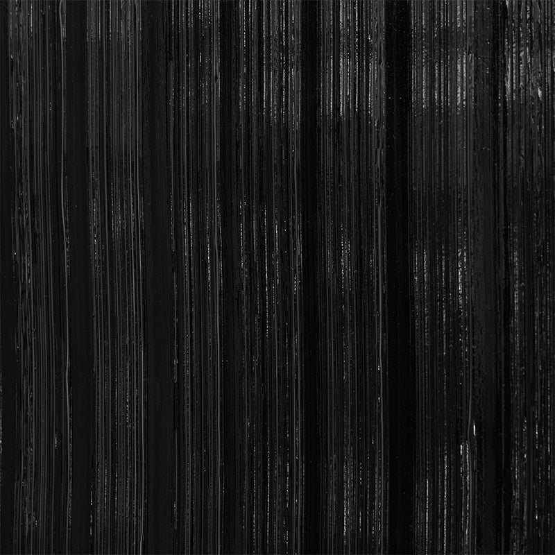 Close-up of black vertical streaks with subtle texture on a wallcovering, resembling brushed metal or dark wood grain for a modern industrial look.