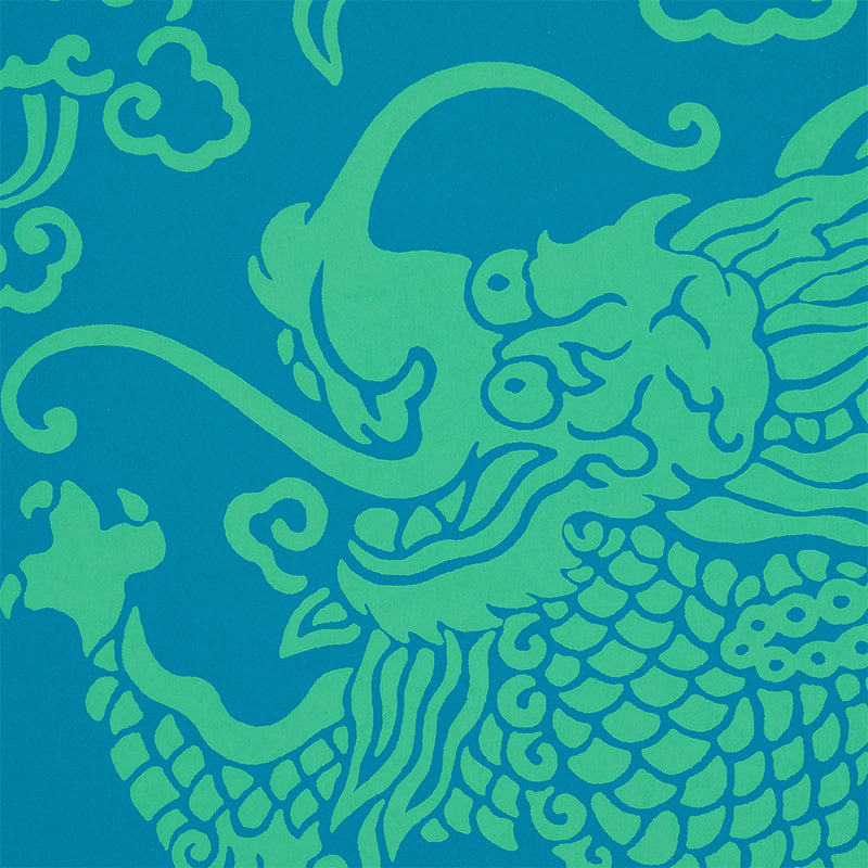 Bright blue fabric with lime-green dragon damask pattern; peacock-inspired, bold, graphic textile.