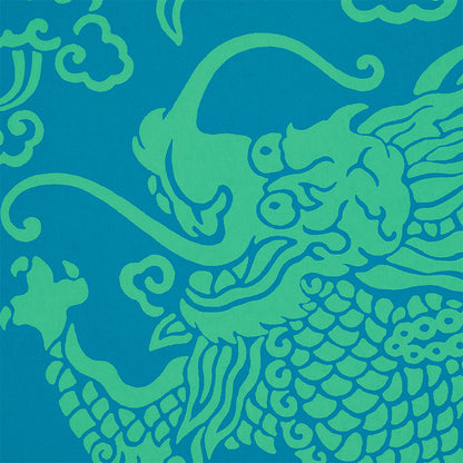 Bright blue fabric with lime-green dragon damask pattern; peacock-inspired, bold, graphic textile.