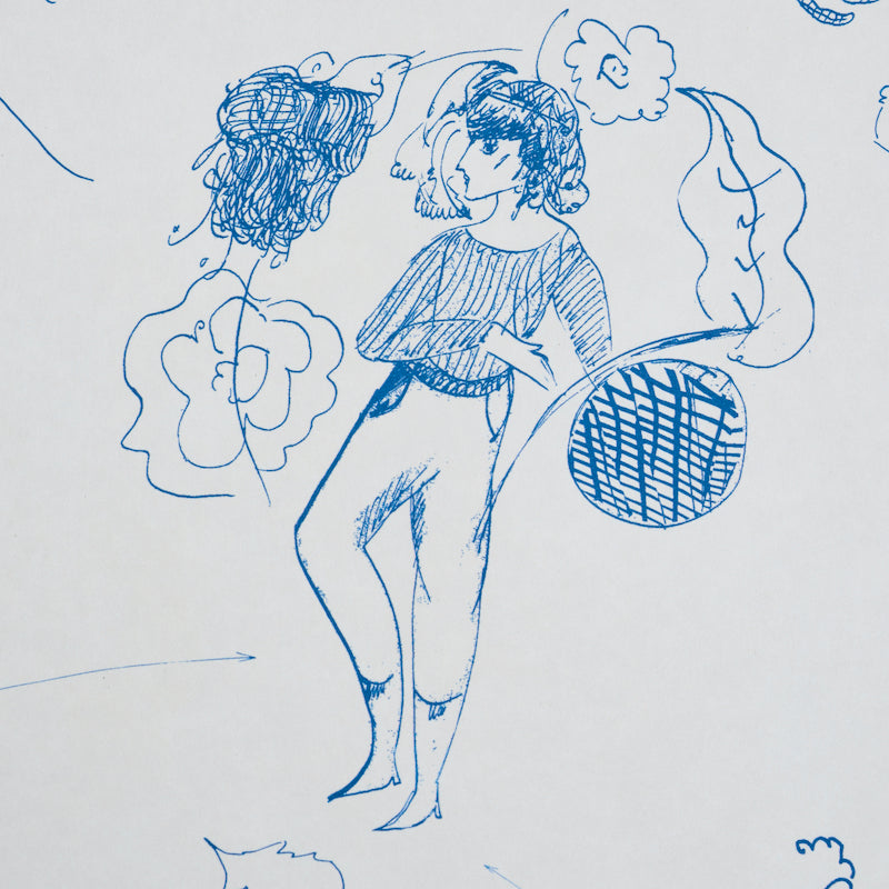 Indigo toile-style fabric pattern featuring stylized female figures and decorative motifs.