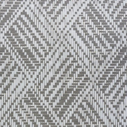 Grayscale woven wallcovering with interlaced light and dark strips forming a geometric diamond/chevron weave.