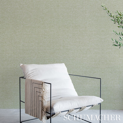 Grey wallpaper with a pale geometric pattern.