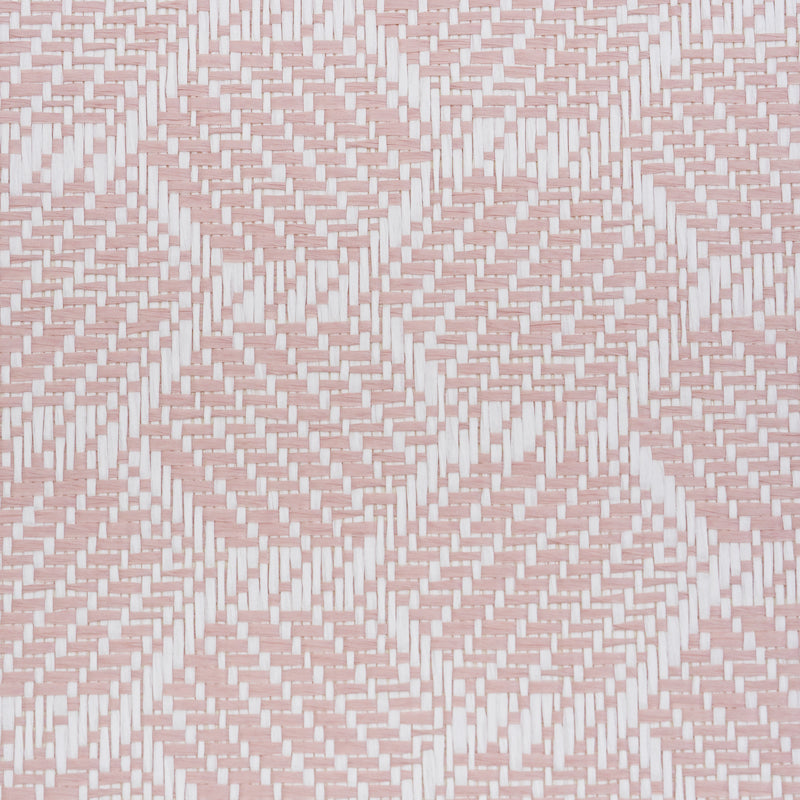Pink and white woven wallpaper close-up with a basketweave texture.