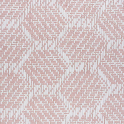 Pink and white woven wallpaper close-up with a basketweave texture.