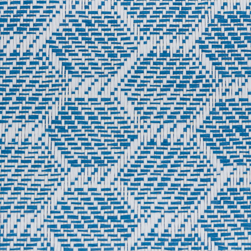 Blue and white woven wallcovering with a diamond basket-weave pattern and textured surface.