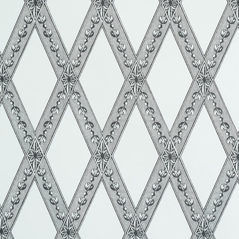 Gray diamond lattice wallpaper with silver floral trim on pale blue background.
