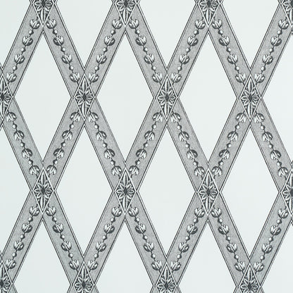 Gray diamond lattice wallpaper with silver floral trim on pale blue background.