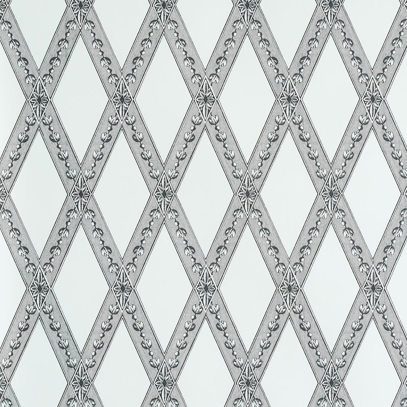Grey-silver diamond lattice wallpaper with floral rosettes at intersections on a pale background.