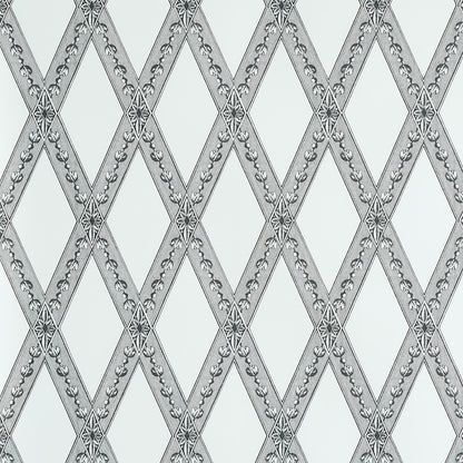 Grey-silver diamond lattice wallpaper with floral rosettes at intersections on a pale background.
