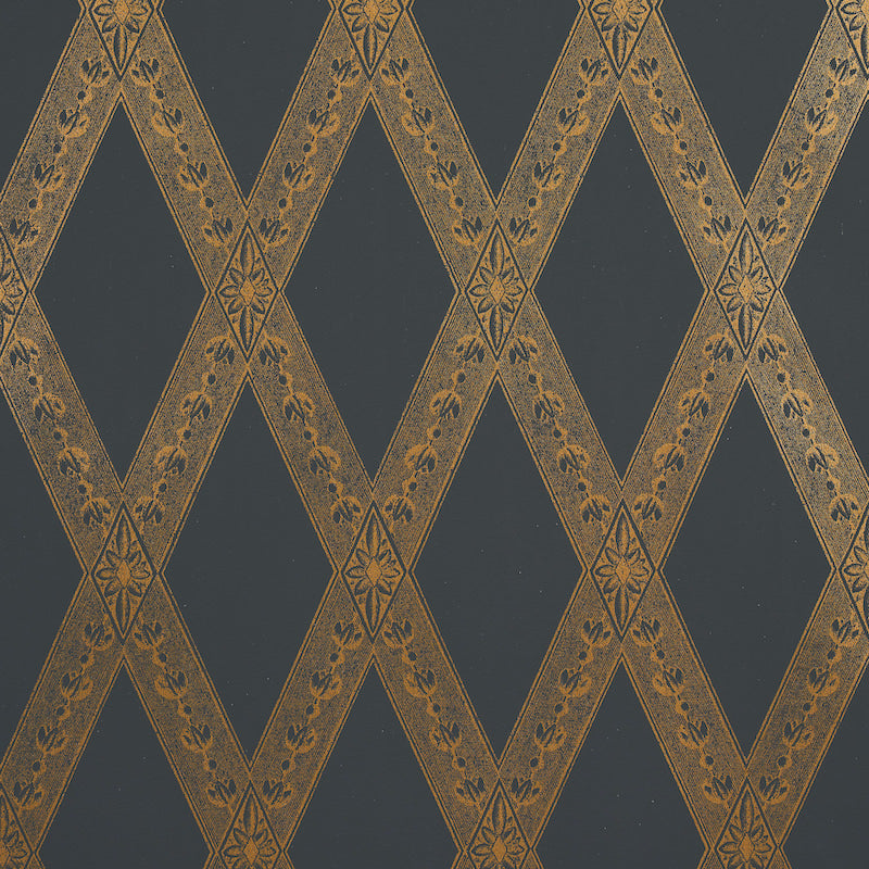 Dark blue wallpaper with gold diamond lattice bands and tiny floral motifs; elegant, damask-inspired wall décor.