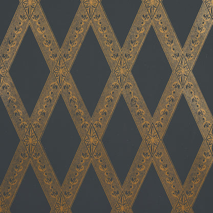 Dark blue wallpaper with gold diamond lattice bands and tiny floral motifs; elegant, damask-inspired wall décor.