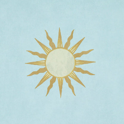 Gold sunburst with alternating straight and wavy rays on a light blue background.