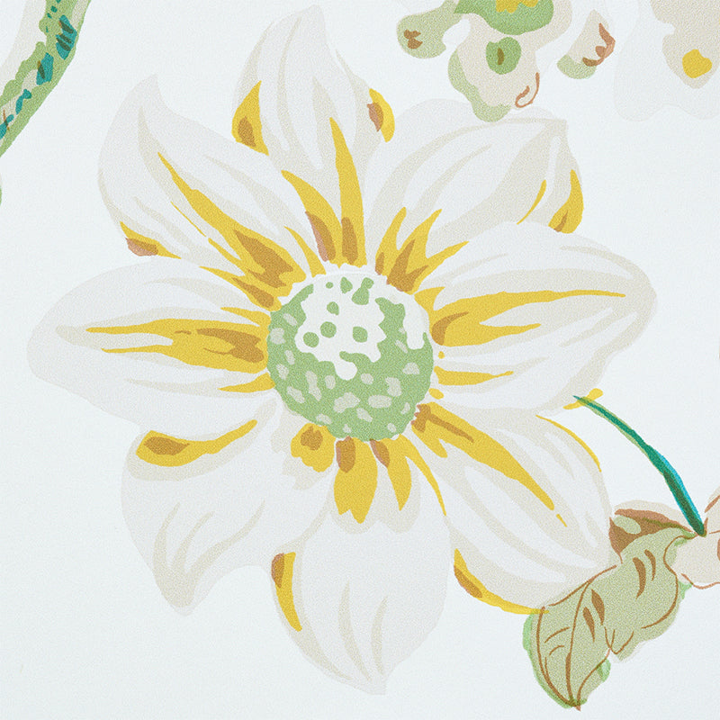 White daisy print with yellow accents, green center, and leafy stems; bright botanical textile design.