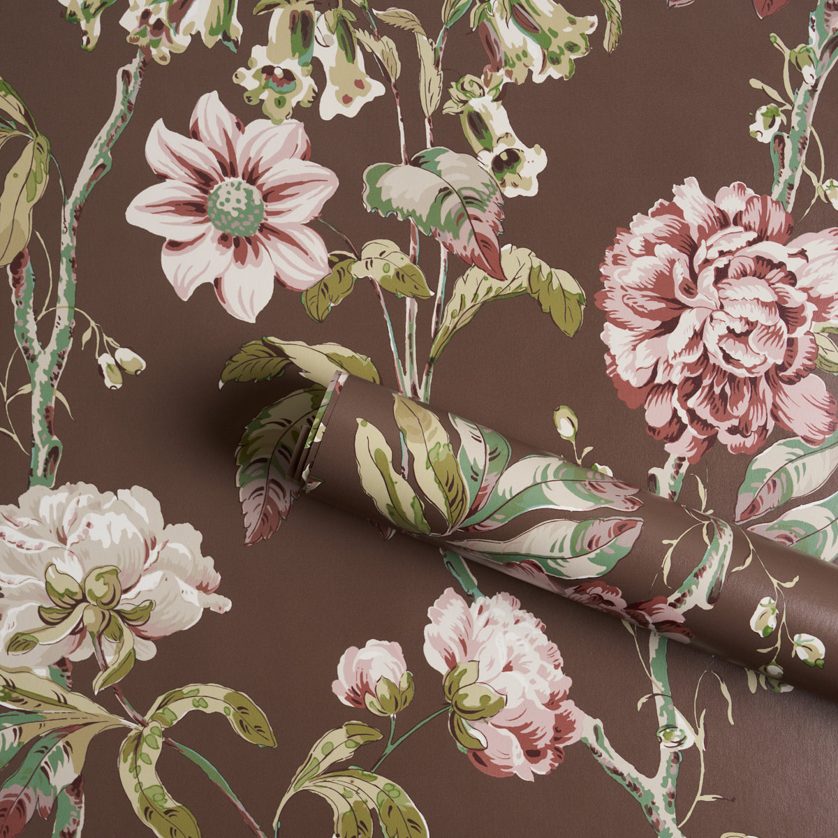 Brown floral wallpaper with large pink peonies and green leaves in a vintage botanical print, rolled sheet.
