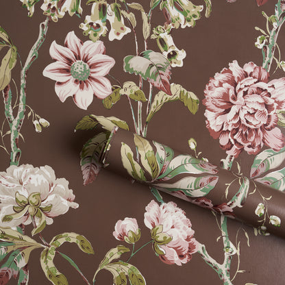 Brown floral wallpaper with large pink peonies and green leaves in a vintage botanical print, rolled sheet.