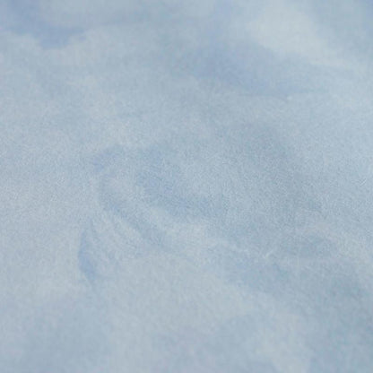 Close-up of soft light-blue fabric panel texture.