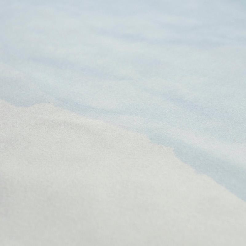 Close-up of a soft textured wallpaper panel in pale blue and cream with a subtle looped texture.