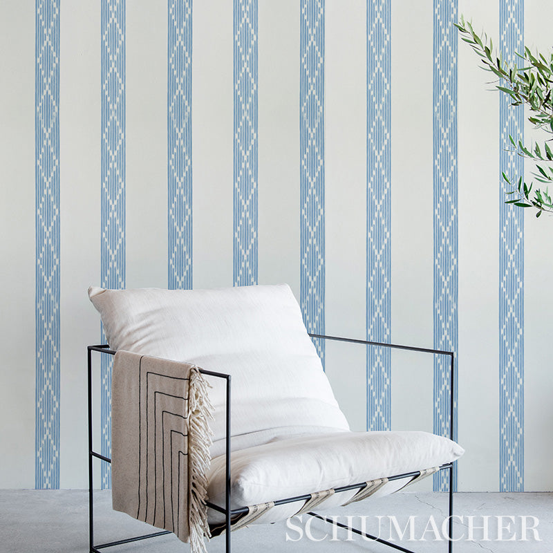 Camel stripe wallpaper on the wall; blue geometric wallpaper visible in the background.
