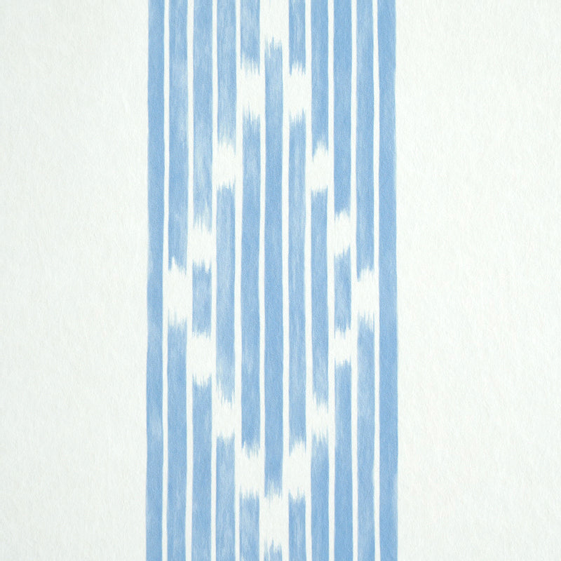 Blue ikat-inspired vertical stripe wallpaper on a light cream background.