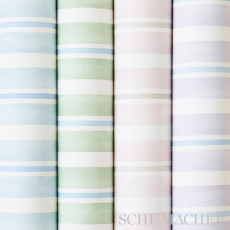 Four pastel-striped wallcovering rolls standing upright in blue, green, pink and lavender; soft cotton-like material.