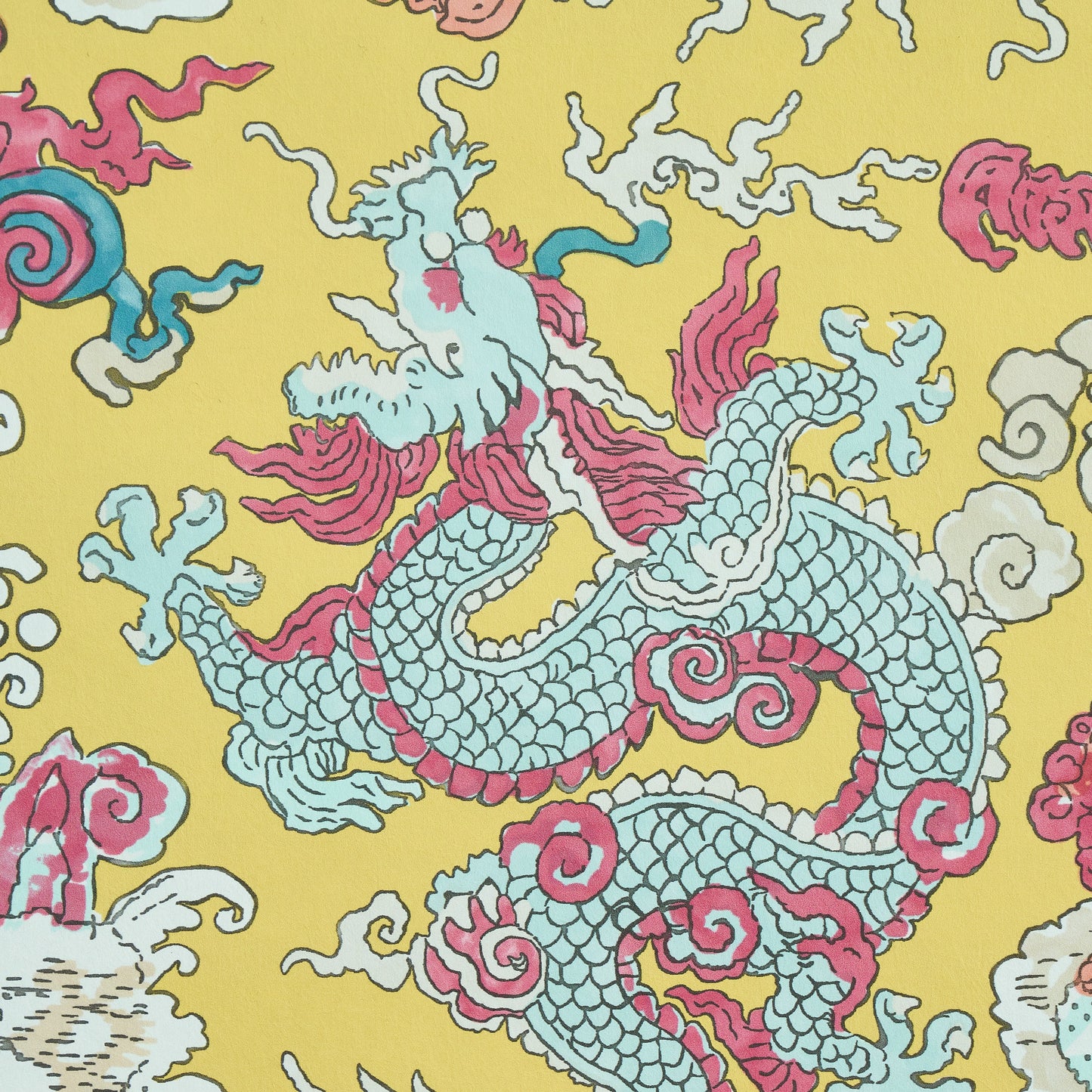 Yellow fabric featuring a blue dragon motif with pink accents, surrounded by white clouds; bold Asian-style textile.