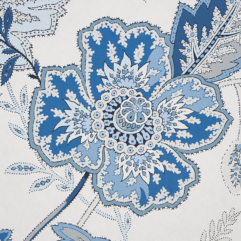 Large blue floral motif with light blue and white petals; lace-like center, vintage botanical fabric print.