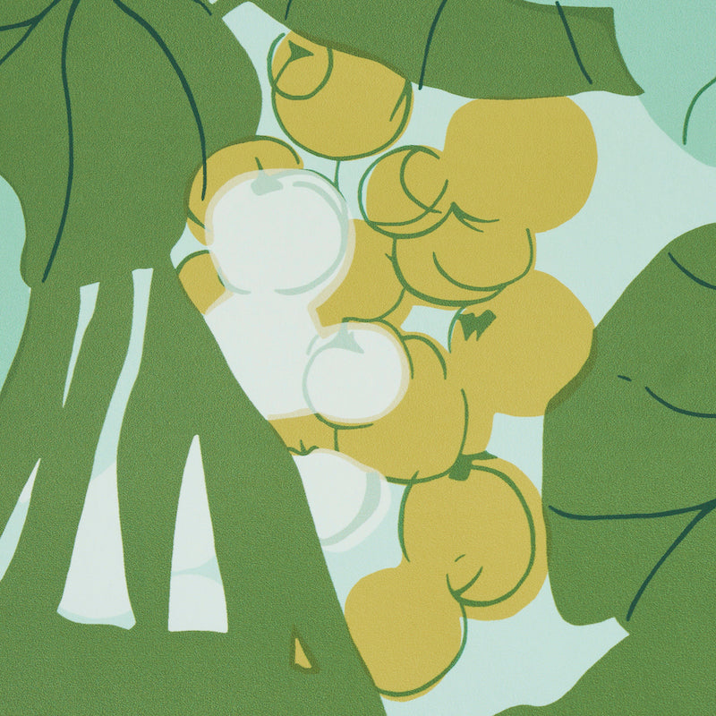 Palm leaves and sea-grape motif print on pale blue fabric.