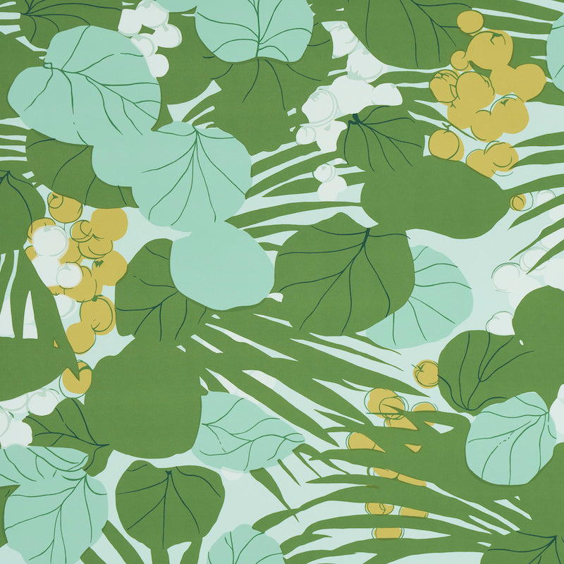 Tropical leaf print with overlapping green and teal leaves and small yellow berries on a light aqua background