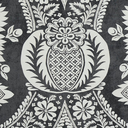 Charcoal gray and white damask textile pattern with a central pineapple-like medallion and scrolling floral motifs.