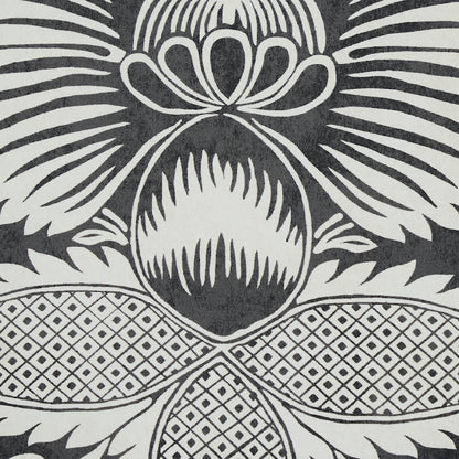 Black and white fabric with a large stylized pineapple motif and geometric lattice panels.