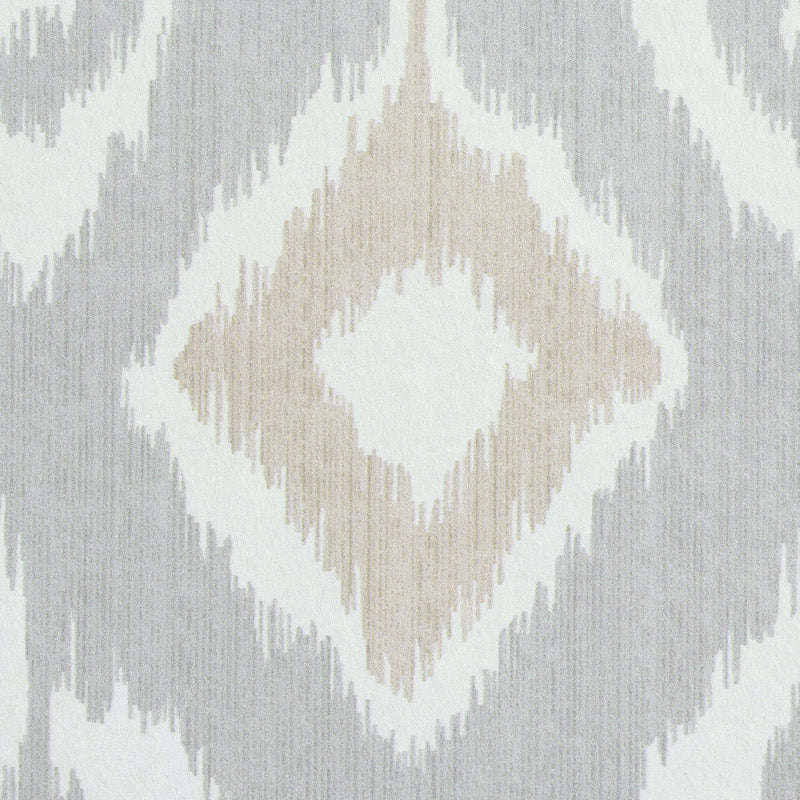 Ikat diamond motif rug in beige, ivory and gray; soft geometric textile.