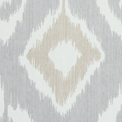 Ikat diamond motif rug in beige, ivory and gray; soft geometric textile.