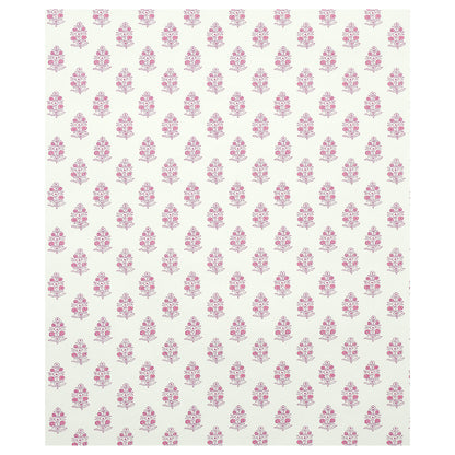 Cream background with repeating pink floral motifs; decorative pattern ideal for wallpaper or stationery.