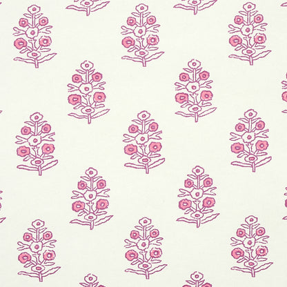 Cream fabric with repeating pink floral motifs featuring small roses on slender stems and leaves.