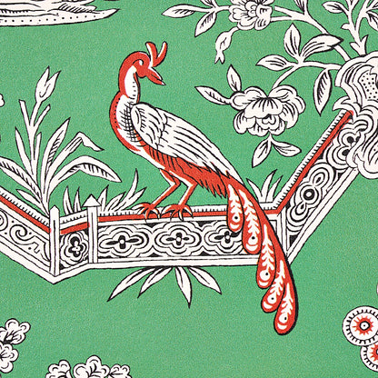 Green background with a white-and-red peacock perched on an ornate carved railing amid florals; folk-art style print.