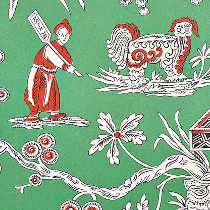 Green fabric with red-and-white folk-art scene: a figure with banner beside a dragon-like white creature, with floral branches.