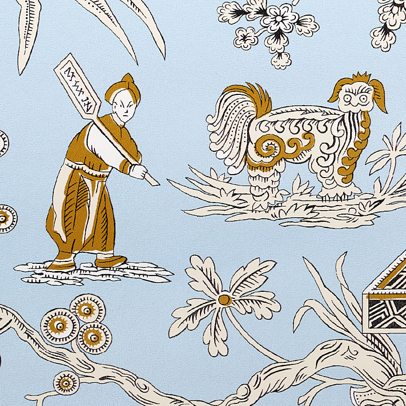 Blue textile with a chinoiserie motif: robed figure holding a sign, stylized rooster, and white flowers with vines in brown and ivory.