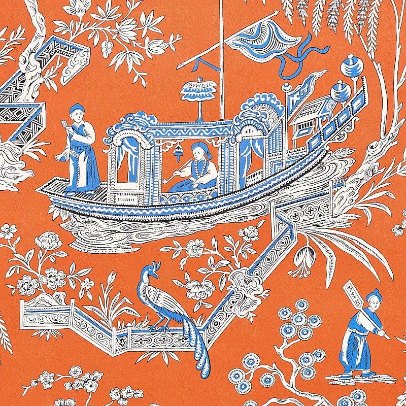 Orange textile with a blue-and-white ornate boat scene, people aboard, a peacock and floral details.