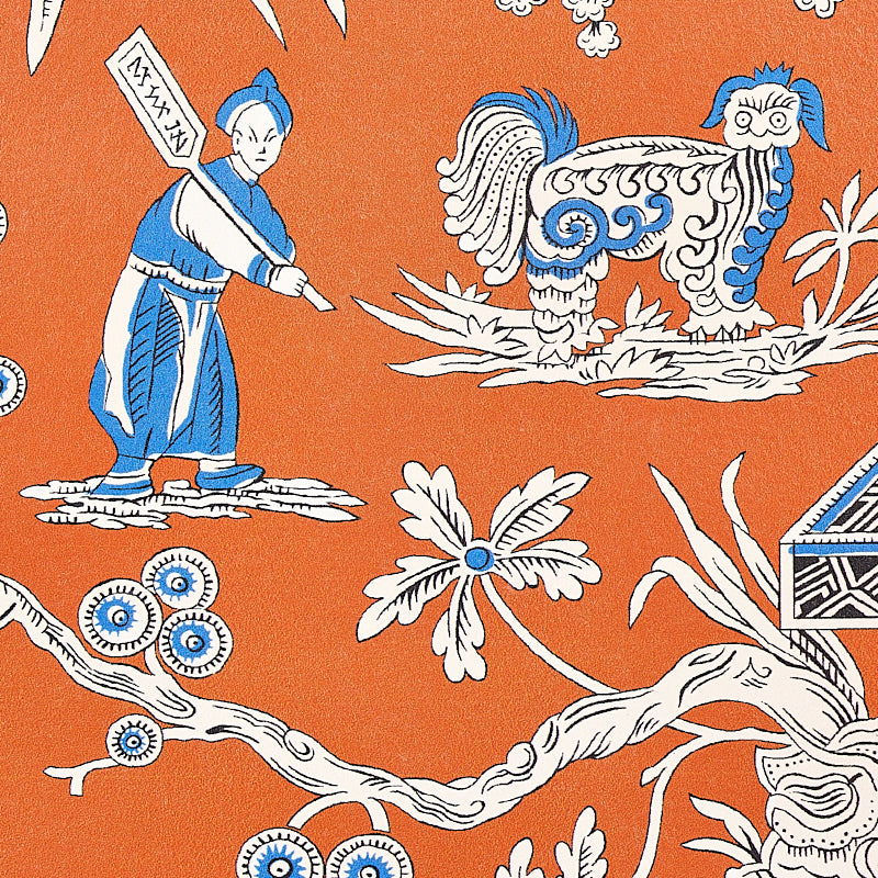 Orange batik-style textile with blue-white dragon, robed figure holding a banner, & flowering branch motif.