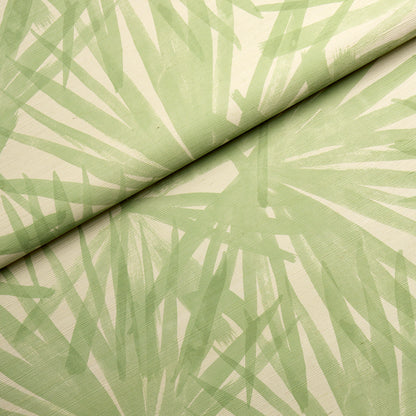 Light green fabric with abstract palm leaf print, rolled at the top.