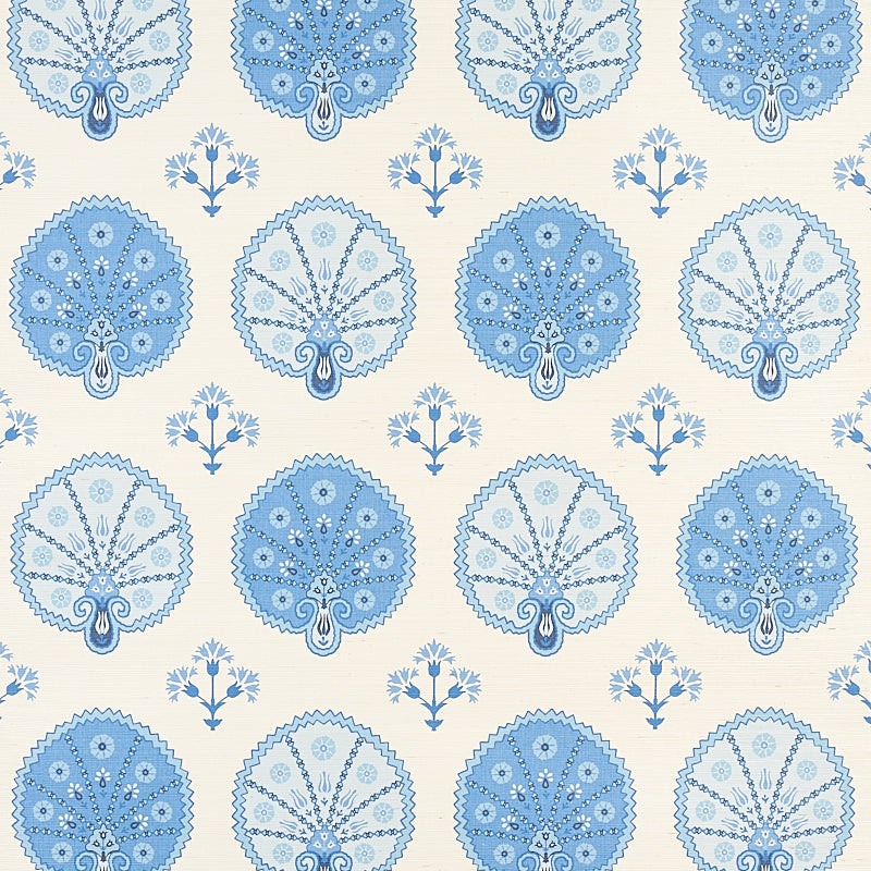 Repeating blue mandala-like medallions with lacework on cream background, interspersed with small blue bouquet motifs.