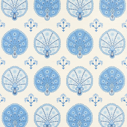 Repeating blue mandala-like medallions with lacework on cream background, interspersed with small blue bouquet motifs.