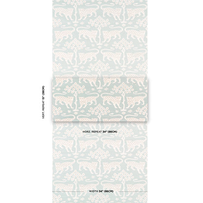Mint green wallpaper roll with repeating white leopard silhouettes and botanical motifs.