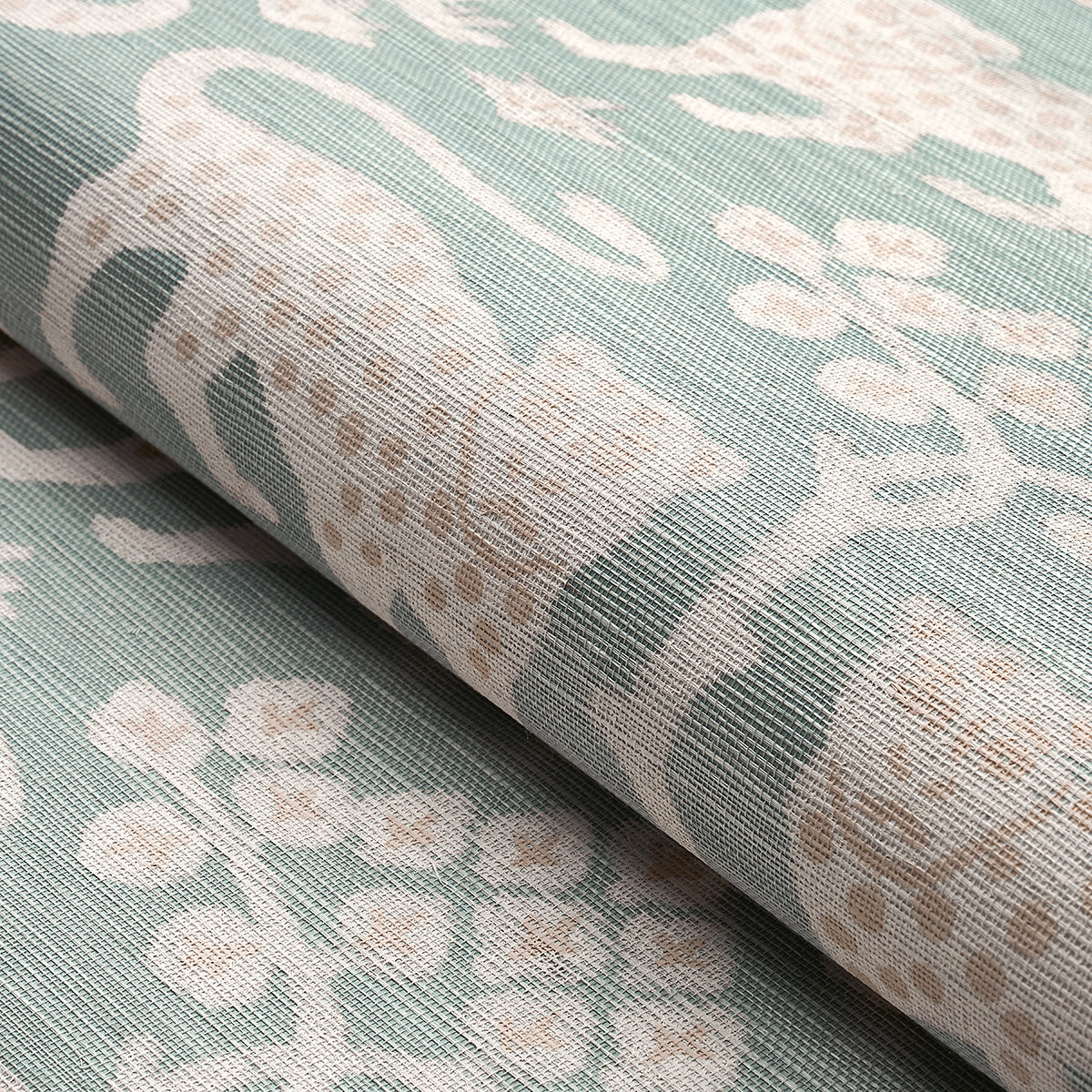 Seafoam teal linen-style fabric with ivory floral damask pattern, rolled edge and textured weave.