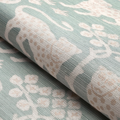 Seafoam teal linen-style fabric with ivory floral damask pattern, rolled edge and textured weave.