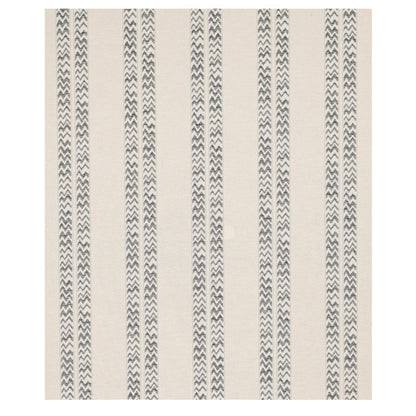 Beige rectangular area rug with vertical dark grey chevron stripes; modern Nordic style, soft woven texture.