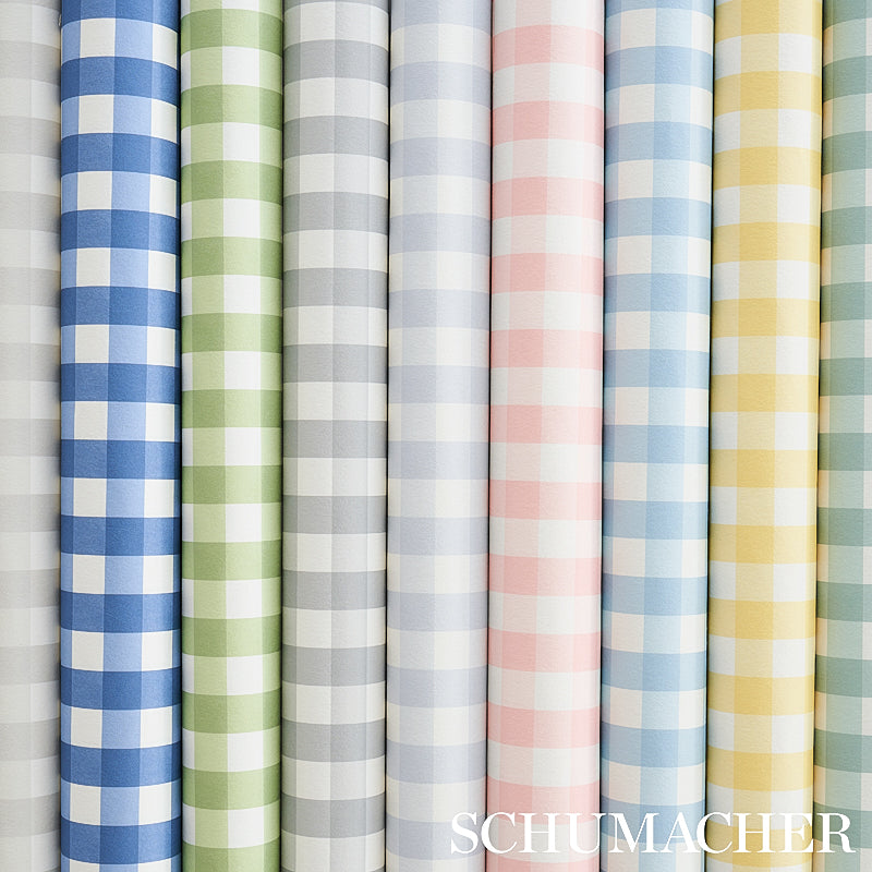 Rows of pastel gingham wallcovering rolls in blue, green, gray, pink & yellow.